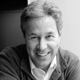 Black and white portrait of Luis Miguel Ariza, smiling